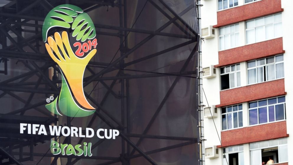 The official World Cup logo is seen on scaffold netting in Salvador on June 14, 2014, during the 2014 FIFA World Cup football tournament.