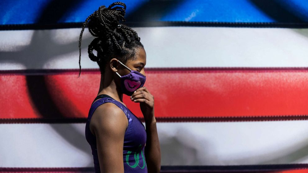 PHOTO: Gymnast Ty-La Morris, 13, wears a protective face mask as she trains at the Wendy Hilliard Gymnastics Foundation in N.Y., Dec. 7, 2020.