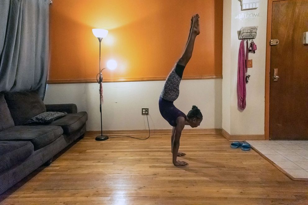 PHOTO: Gymnast Ty-La Morris, 12, trains at her home during the coronavirus disease (COVID-19) outbreak, in New Windsor, in N.Y., May 22, 2020.