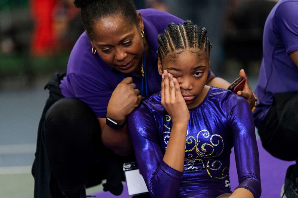 PHOTO: Wendy Hilliard, a Hall of Fame rhythmic gymnast and founder of the Wendy Hilliard Gymnastics Foundation, consoles gymnast Chelsea Taylor Moore during The Harlem Gymnastics Invitational competition at the foundation in New York, Feb. 22, 2020.