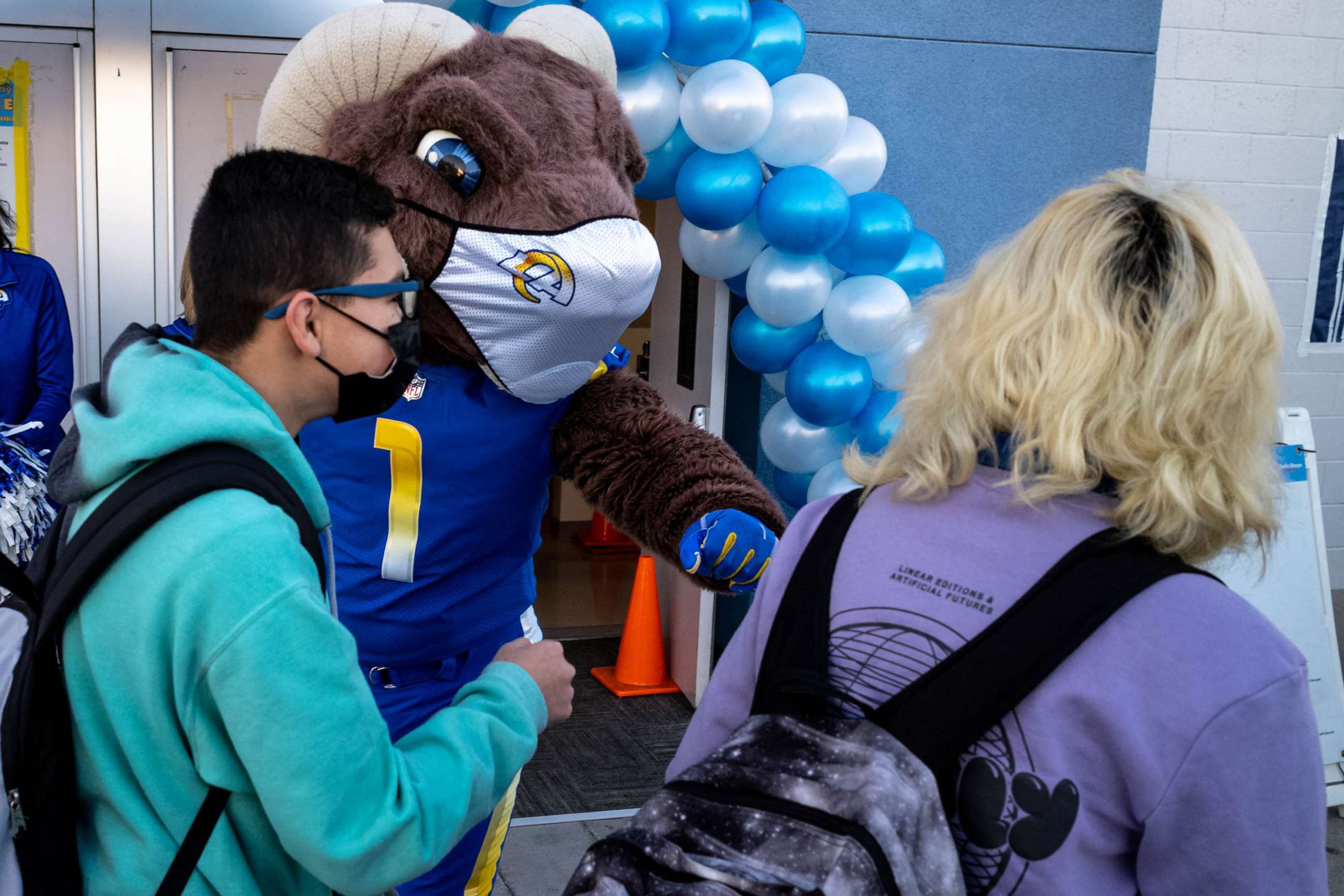 PHOTO: Students are greeted by Rampage the LA Rams mascot at Olive Vista Middle School in Sylmar, Calif., Jan. 11, 2021. 