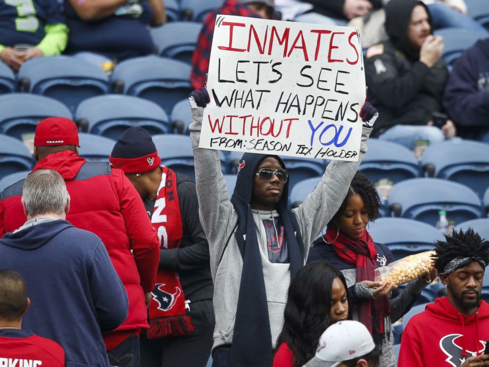 PHOTO: A Houston Texans fan holds a sign referring to Houston Texans owner Bob McNairs inmates comments before a game between the Houston Texans and Seattle Seahawks at CenturyLink Field on Oct. 29, 2017 in Seattle.