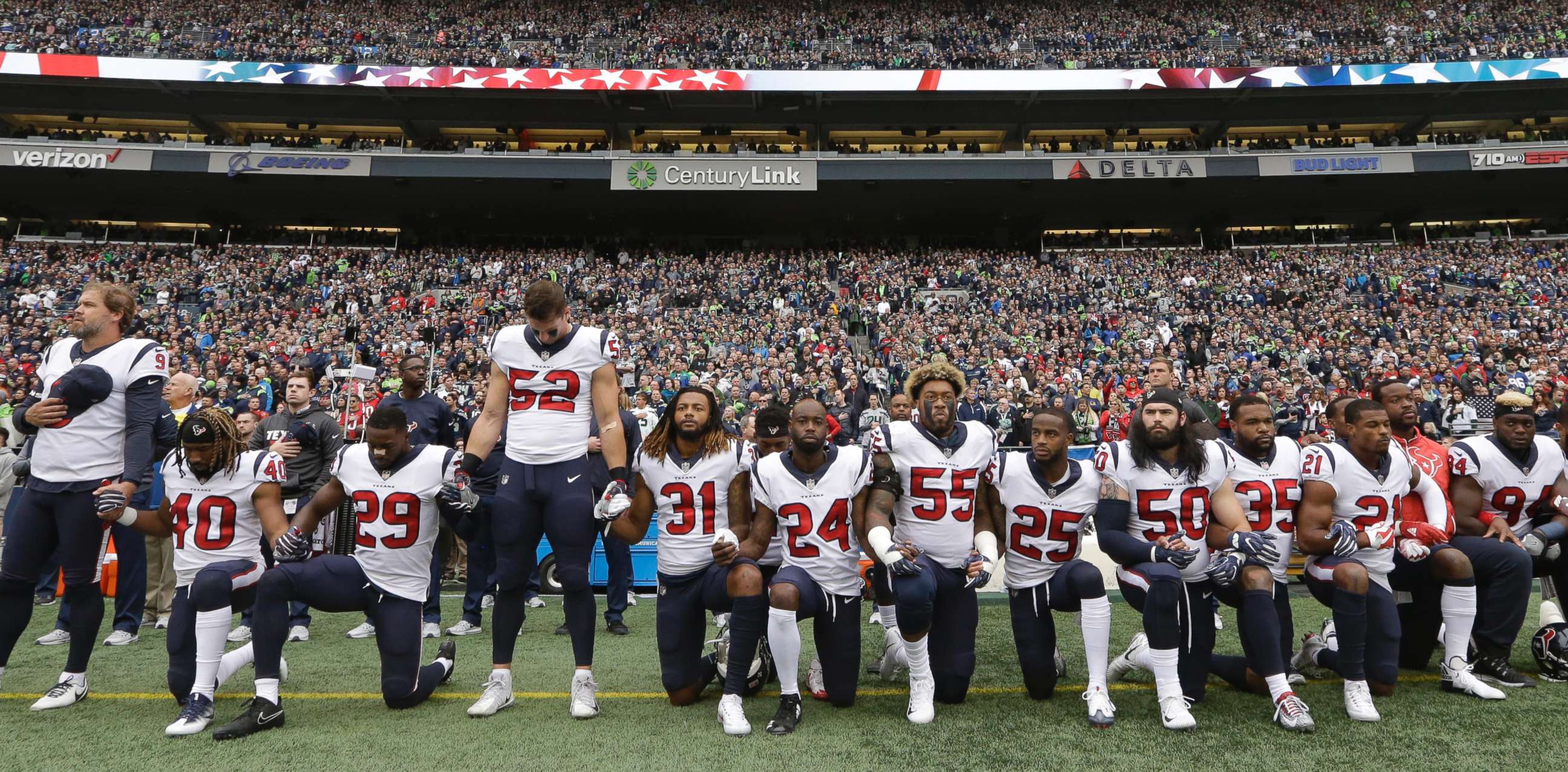 PHOTO: Houston Texans players kneel and stand during the singing of the national anthem before an NFL football game against the Seattle Seahawks, Oct. 29, 2017, in Seattle.