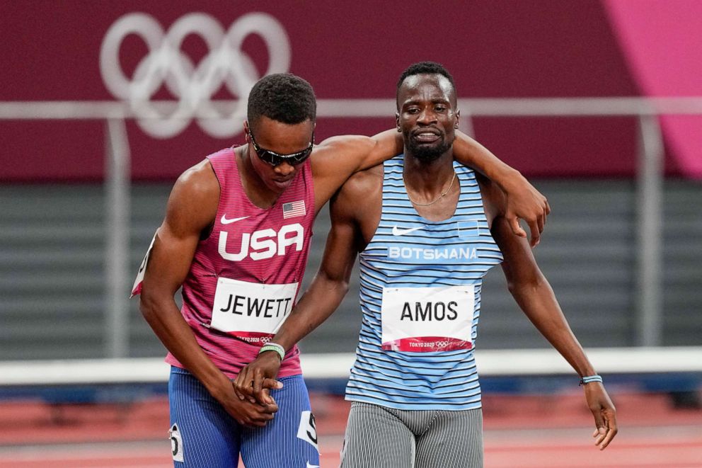 PHOTO: Isaiah Jewett, of the United States, and Nijel Amos, right, of Botswana, shake hands after falling in the men's 800-meter semifinal at the 2020 Summer Olympics, Sunday, Aug. 1, 2021, in Tokyo.