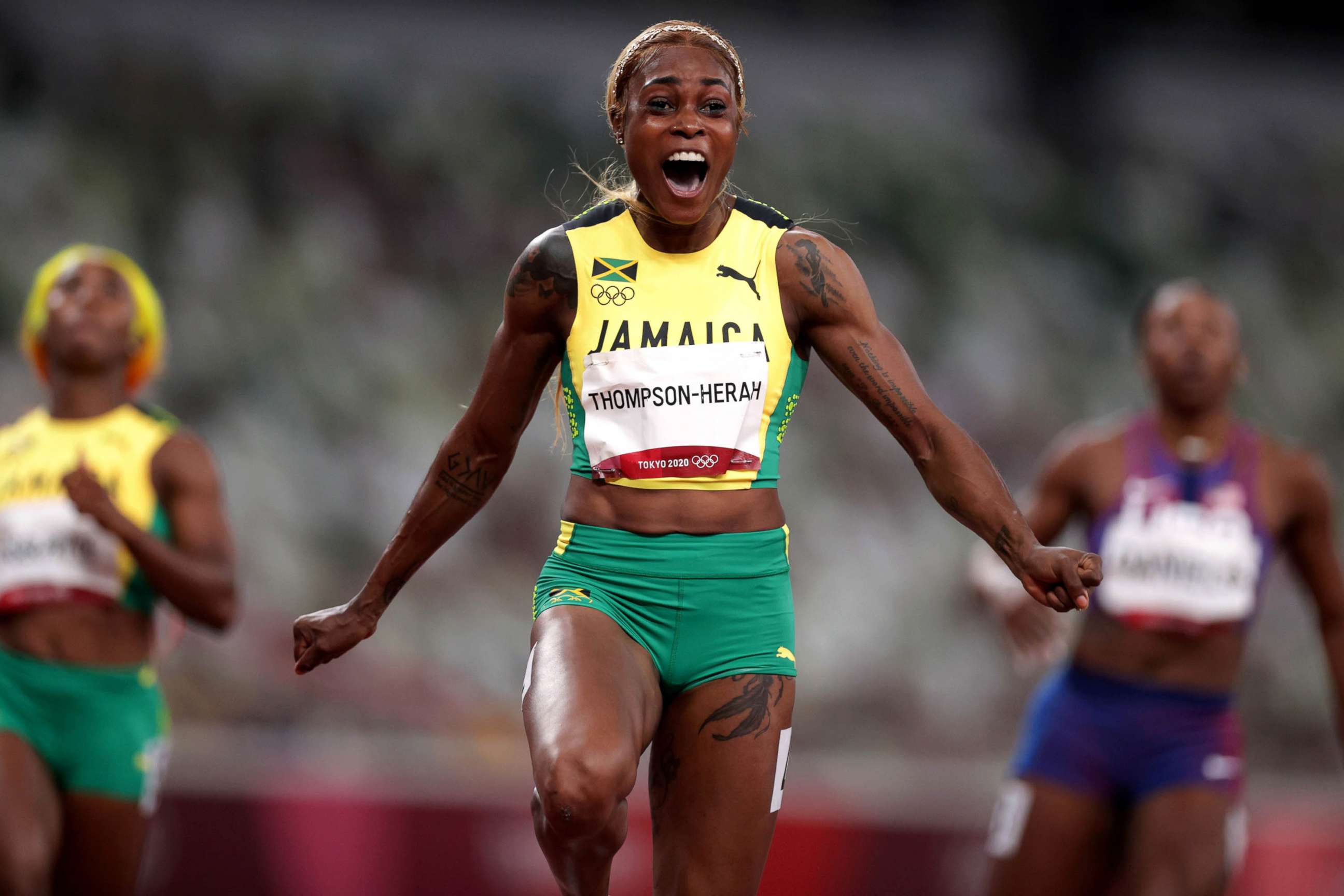 PHOTO: Elaine Thompson-Herah of Jamaica celebrates crossing the finish line to win gold in the Women's 100m Final at the Olympic Stadium, Tokyo, July 31, 2021. 