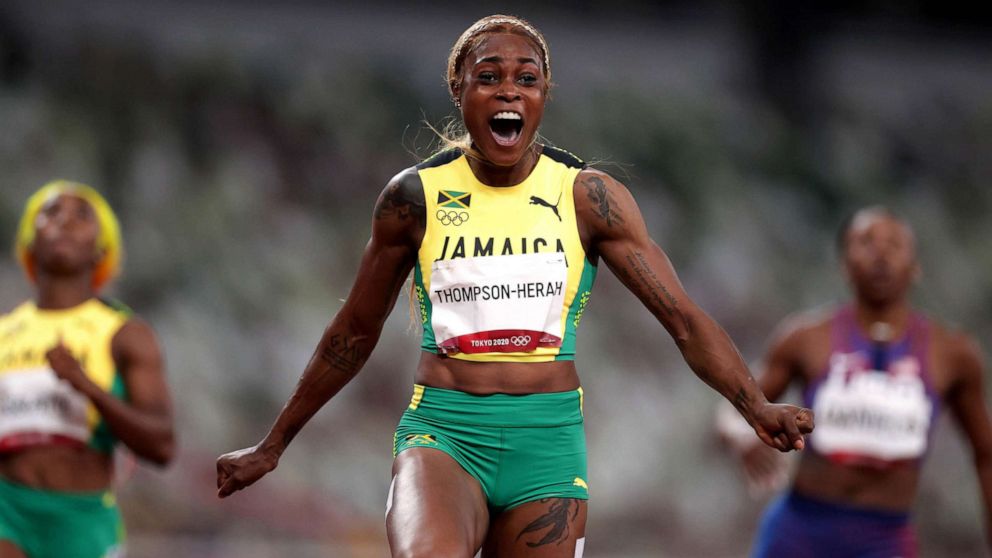 PHOTO: Elaine Thompson-Herah of Jamaica celebrates crossing the finish line to win gold in the Women's 100m Final at the Olympic Stadium, Tokyo, July 31, 2021. 