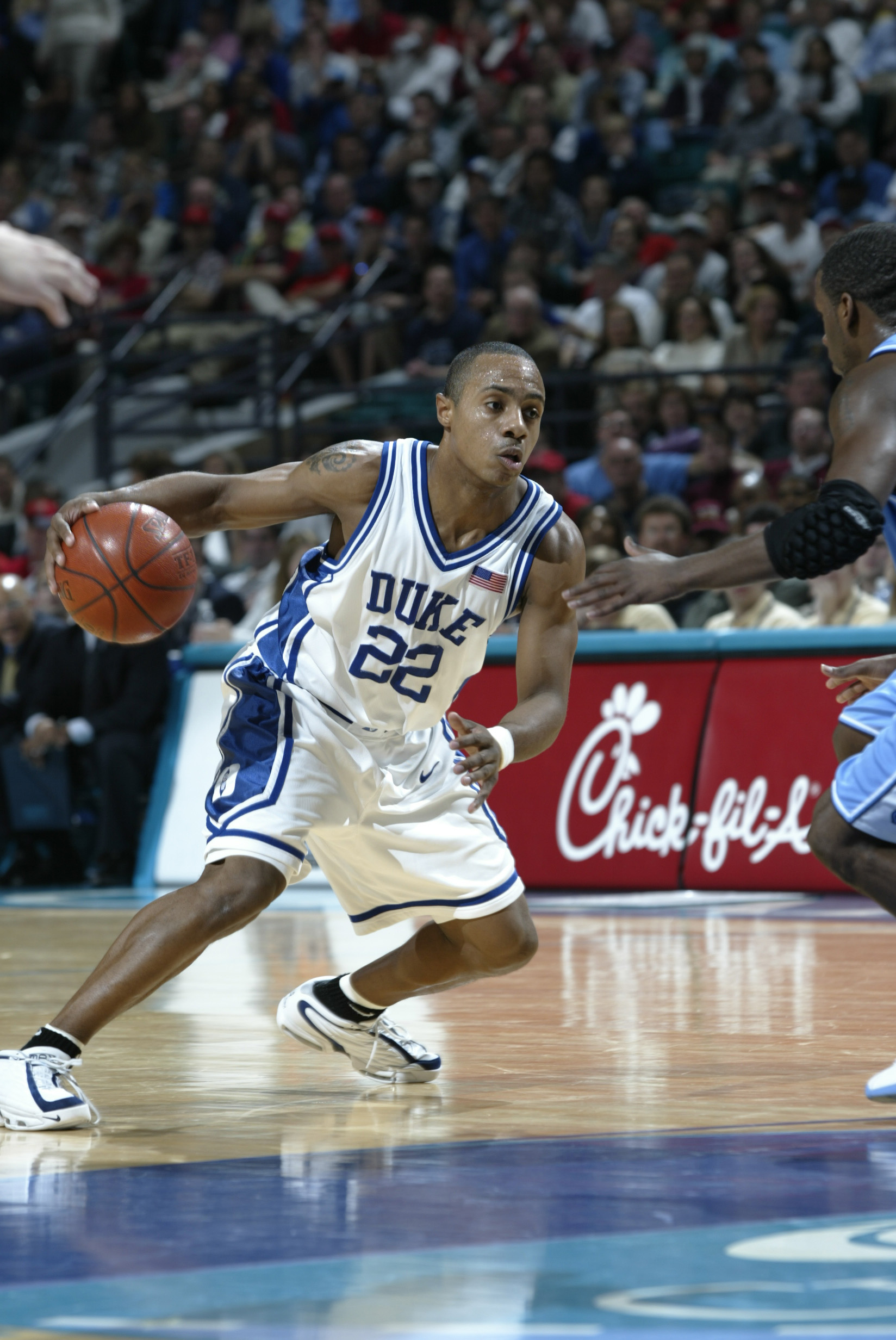 PHOTO: Jason Williams of Duke moves against the defense of North Carolina during the ACC Tournament game at the Charlotte Coliseum in Charlotte, North Carolina.