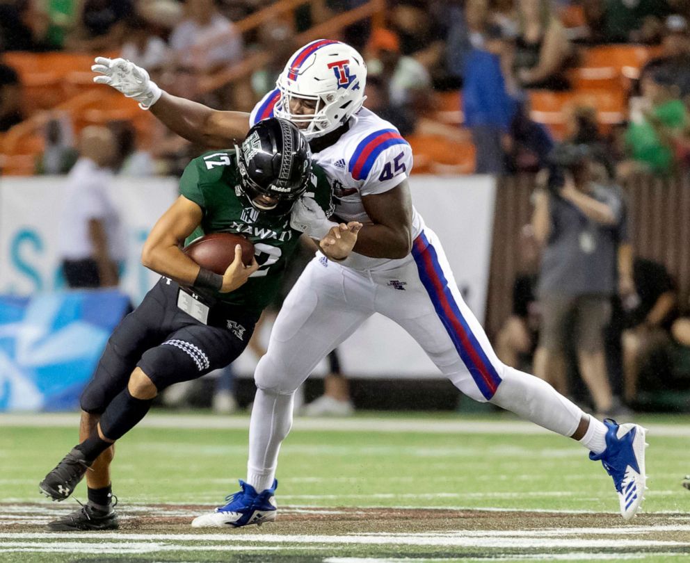 PHOTO: In this Dec. 22, 2018, file photo, Louisiana Tech defensive end Jaylon Ferguson sacks Hawaii quarterback Chevan Cordeiro in the first half of the Hawaii Bowl NCAA college football game, in Honolulu.