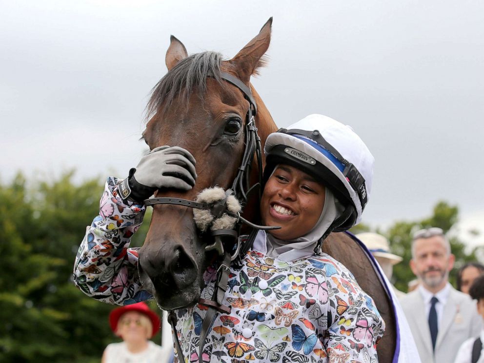 PHOTO: British Jockey Khadijah Mellah cuddles Haverland after winning the all-female Magnolia Cup, an amateur jockeys charity race, on Thursday, Aug. 1, 2019.