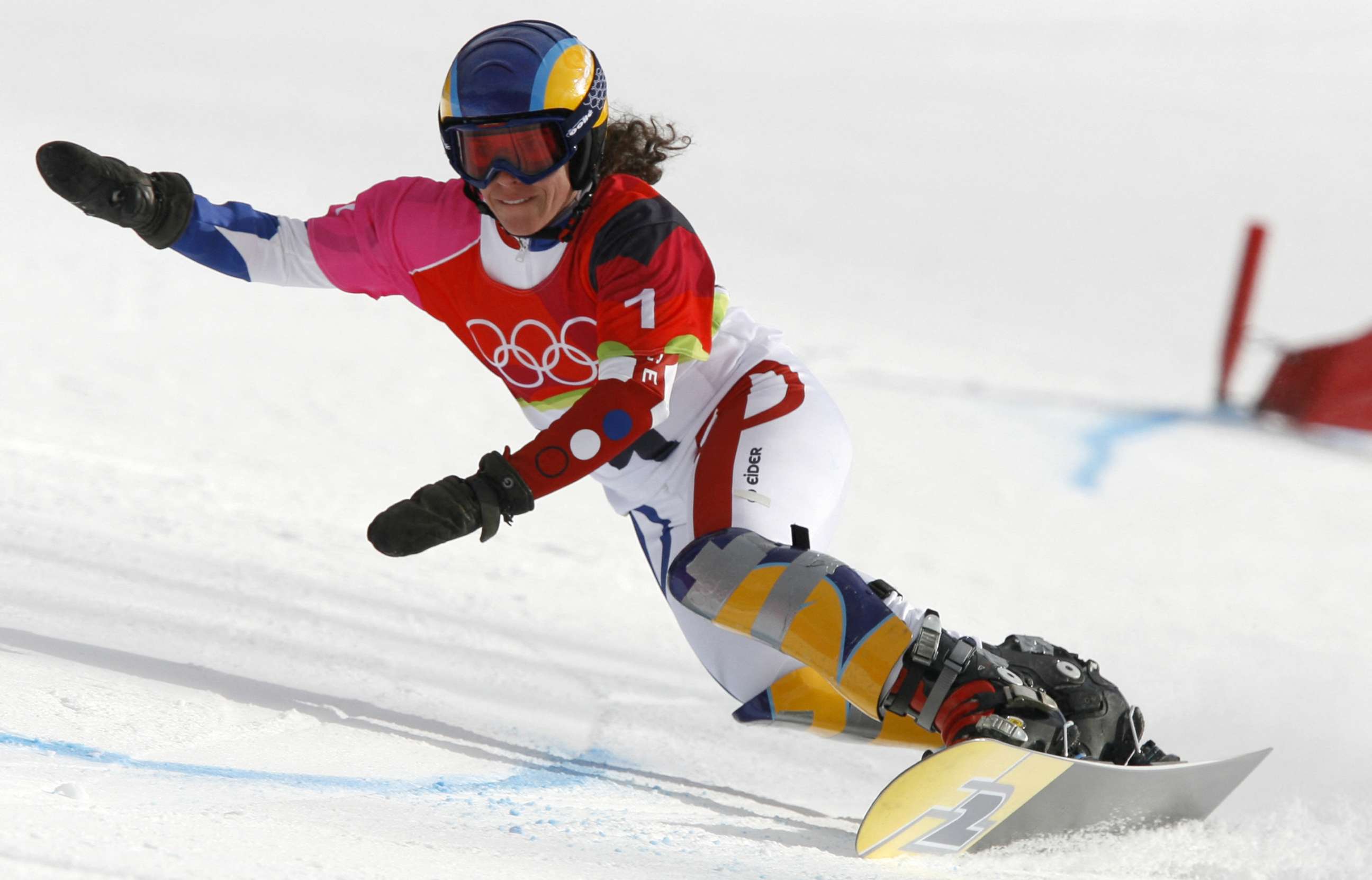 PHOTO: French snowboarder Julie Pomagalski speeds down the course while competing in the women's giant parallel slalom at the 2006 Winter Olympics in Turin, Italy, on Feb. 23, 2006.