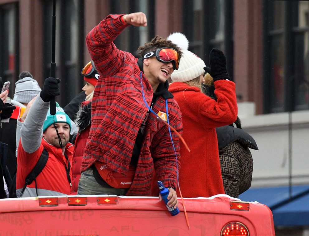 PHOTO: Kansas City Chiefs quarterback Patrick Mahomes cheers with the crowd during a parade through downtown Kansas City, Mo., Feb. 5, 2020 to celebrate the City Chiefs victory in the NFL's Super Bowl 54.