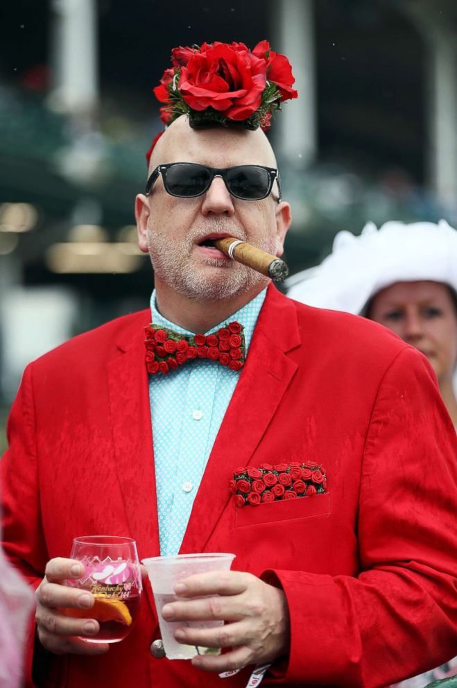 PHOTO: A fan watches the action trackside prior to the 144th Kentucky Derby at Churchill Downs, May 5, 2018 in Louisville, Ky.