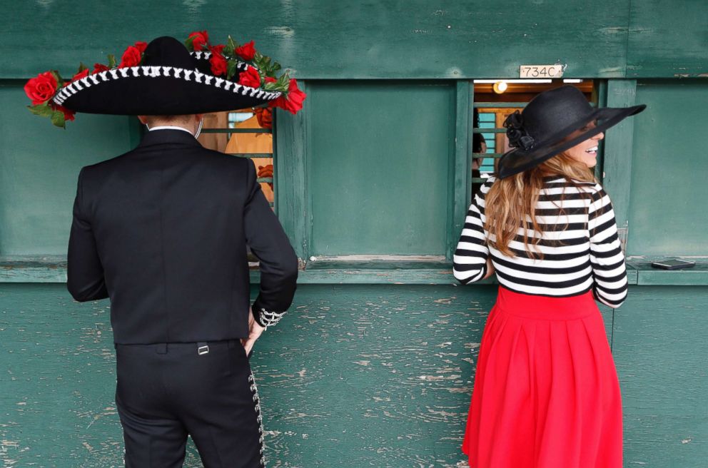 PHOTO: Fans place bets before the 144th running of the Kentucky Derby horse race at Churchill Downs, May 5, 2018, in Louisville, Ky.