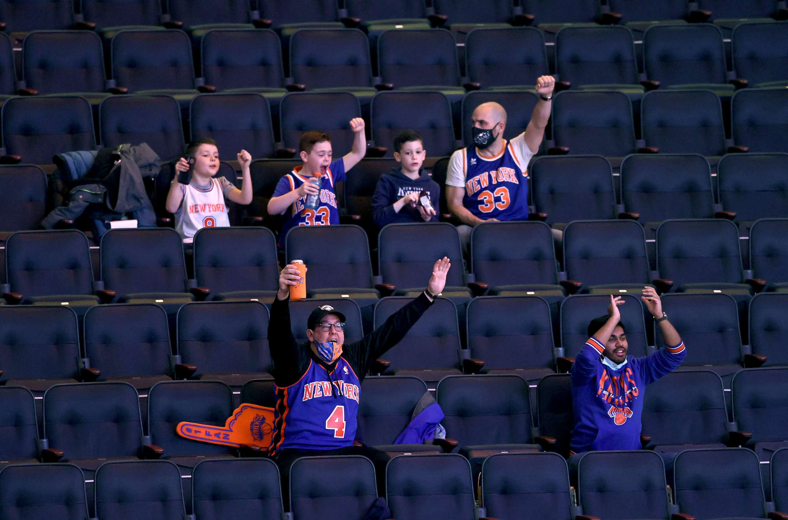 PHOTO: New York Knicks fans cheer as the team takes the court before the game against the Indiana Pacers at Madison Square Garden, Feb. 27, 2021, in New York City.