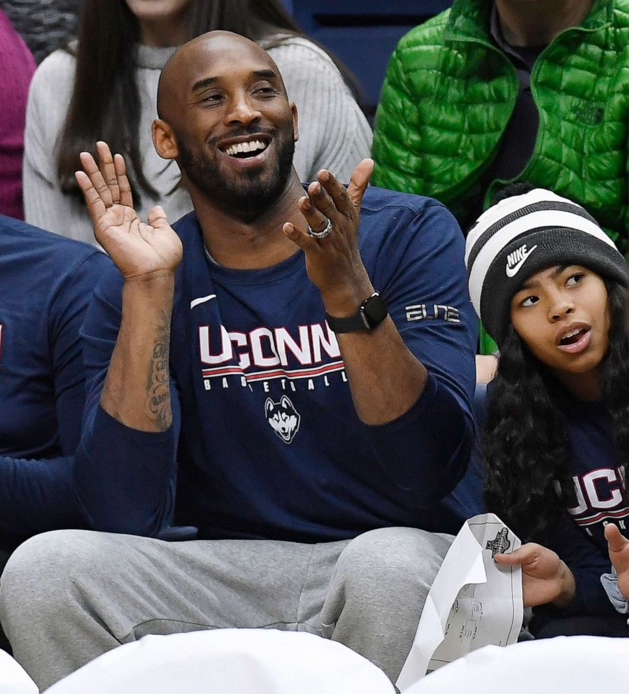 PHOTO:In this March 2, 2019 photo, Kobe Bryant and his daughter Gianna watch a NCAA college basketball game between Connecticut and Houston in Storrs, Conn.