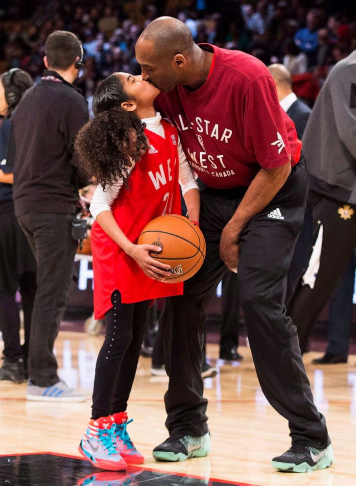 PHOTO: In this Feb. 14, 2016, file photo, Los Angeles Lakers Kobe Bryant kisses his daughter Gianna on the court in warm-ups before first half NBA All-Star Game basketball action in Toronto.