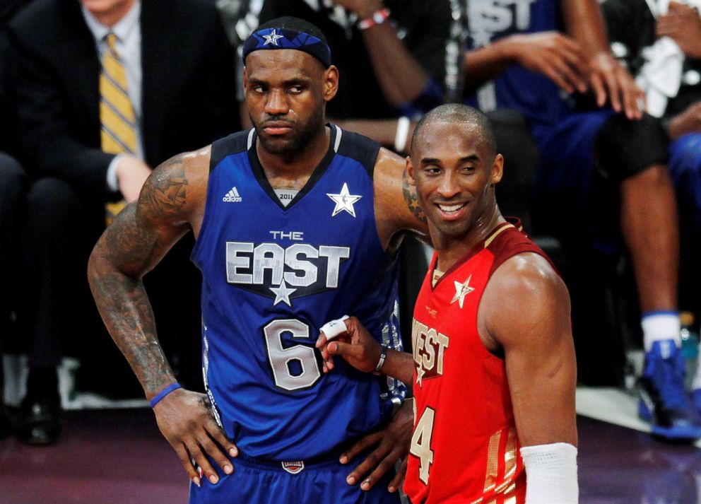 PHOTO: West All Star Kobe Bryant of the Los Angeles Lakers stands with East All Star LeBron James of the Miami Heat near the end of the NBA All-Star basketball game in Los Angeles, Feb. 20, 2011.