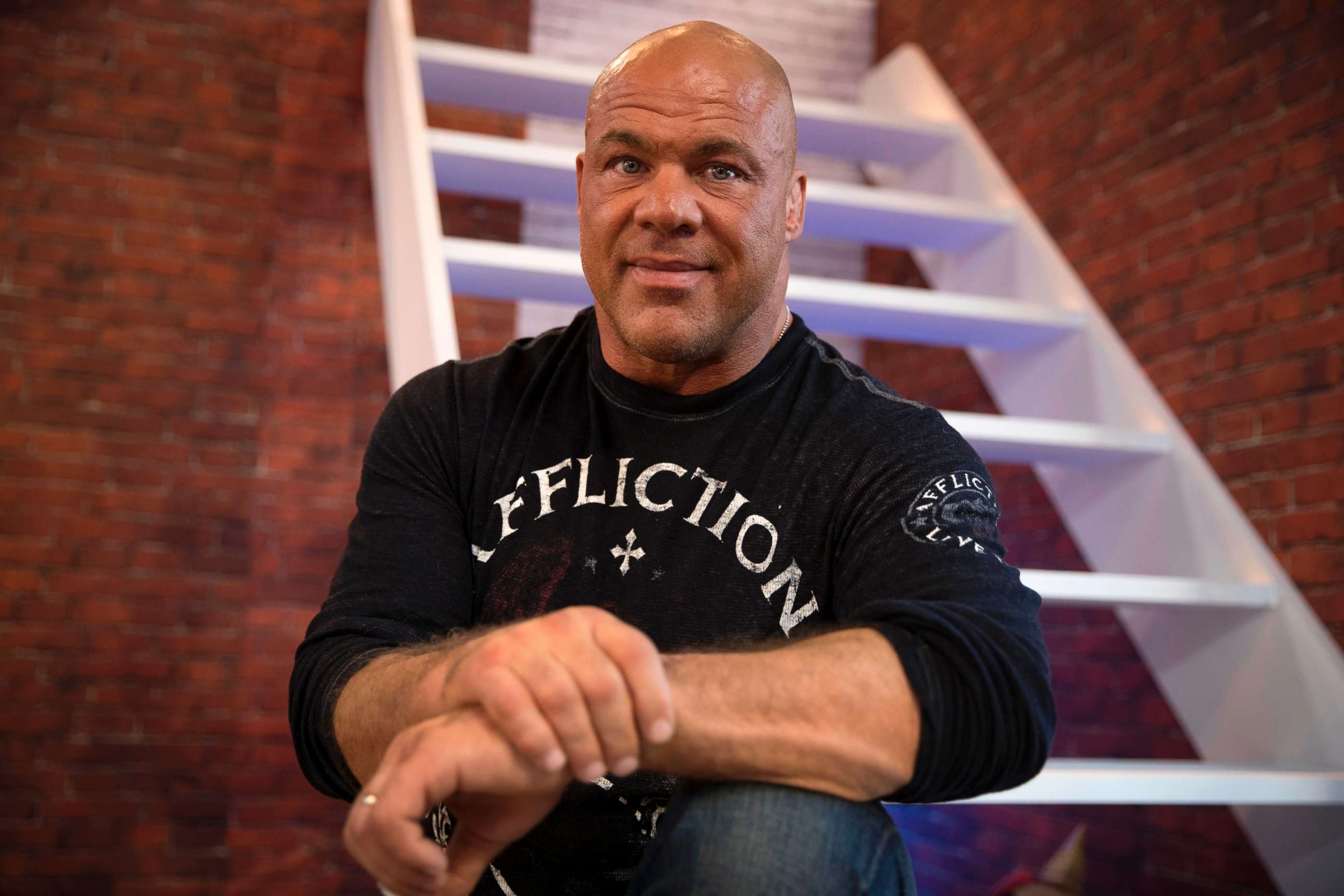 PHOTO: U.S. wrestler and actor Kurt Angle poses on November 4, 2017, as he attends the 2017 Paris Games Week, at the Porte de Versailles exhibition centre in Paris.