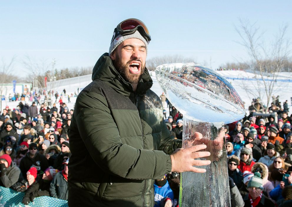 PHOTO: Super Bowl champion and Kansas City Chiefs player Laurent Duvernay-Tardif reacts next to an ice sculpture of the Vince Lombardi Trophy during an event to celebrate his win, in Montreal, Sunday, Feb. 9, 2020.