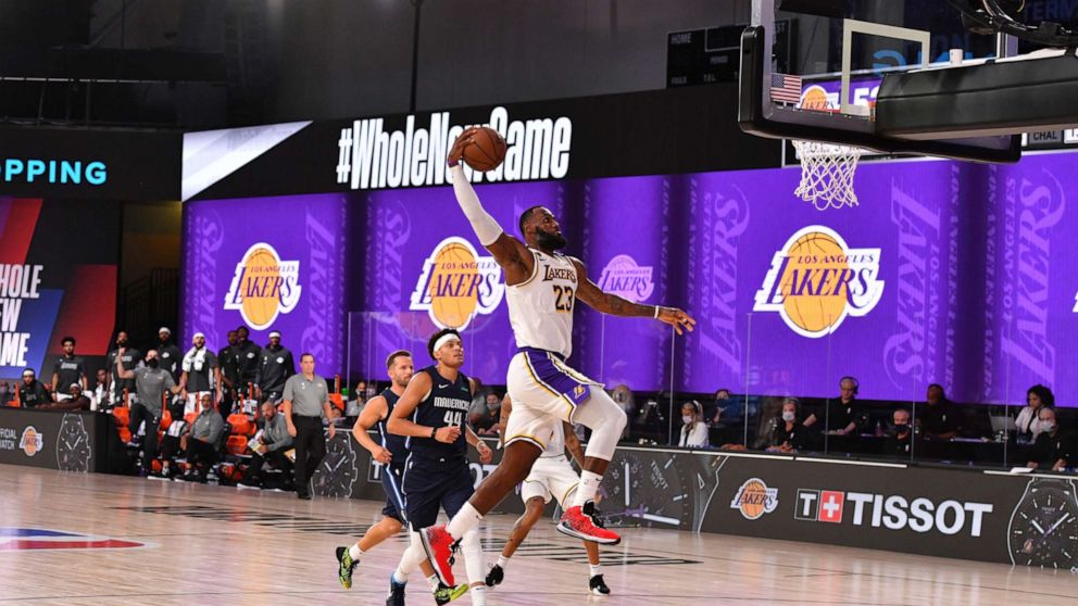 PHOTO: LeBron James of the Los Angeles Lakers dunks the ball against the Dallas Mavericks on July 23, 2020, at the Visa Athletic Center at ESPN Wide World of Sports Complex in Orlando, Fla.
