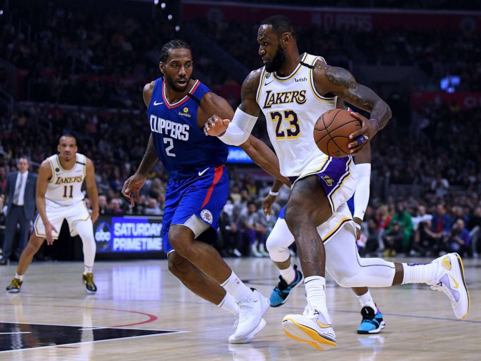 PHOTO: LeBron James #23 of the Los Angeles Lakers drives to the basket on Kawhi Leonard #2 of the LA Clippers during a 112-103 Lakers win at Staples Center on March 8, 2020 in Los Angeles, California.