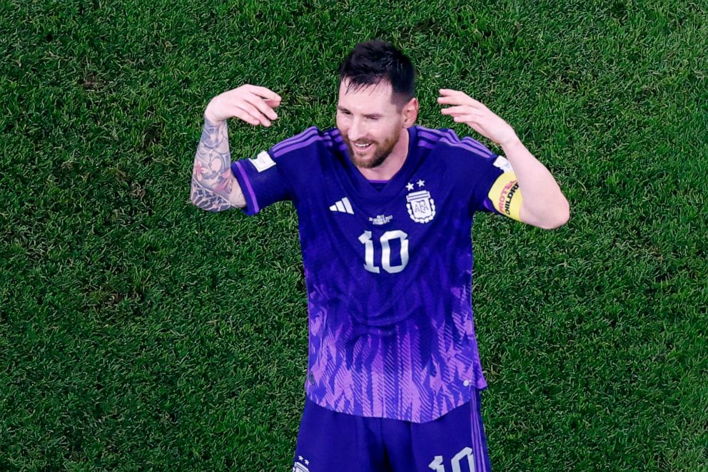 PHOTO: Argentina's Lionel Messi celebrates after the match as Argentina qualified for the knockout stages with a win over Poland, Nov. 30, 2022.