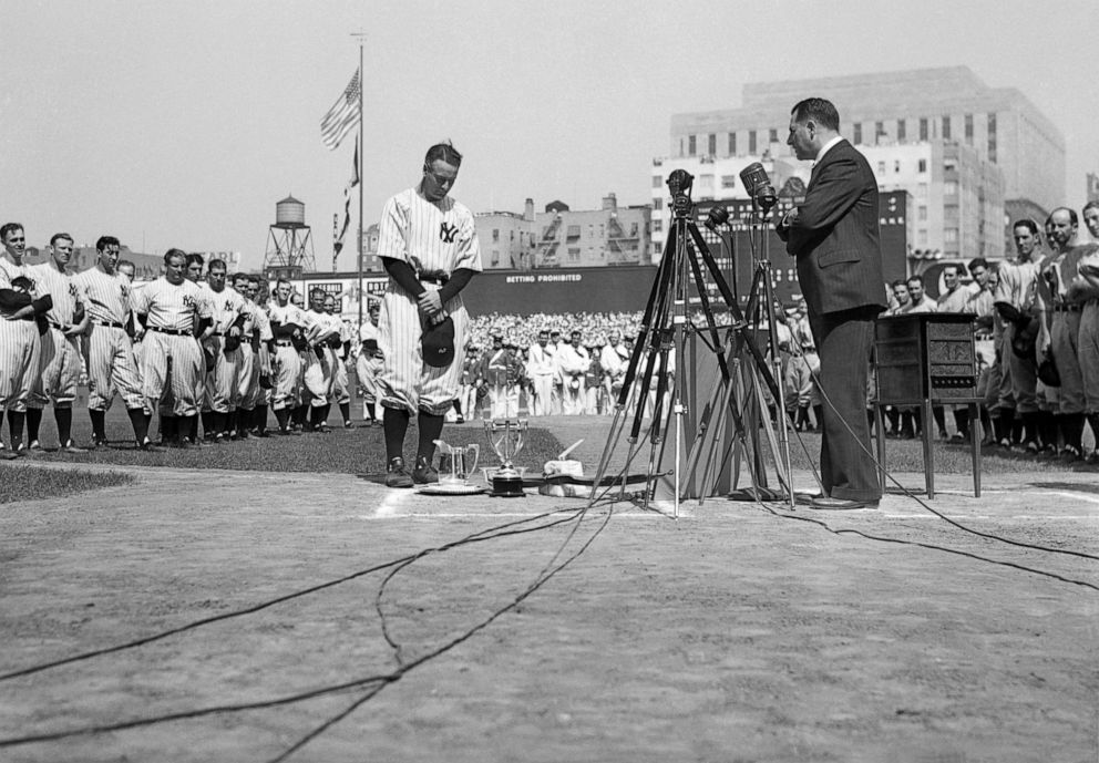 PHOTO: Lou Gehrig stands with head bowed at Yankee Stadium, July 4, 1939, while being honored at Yankee Stadium.
