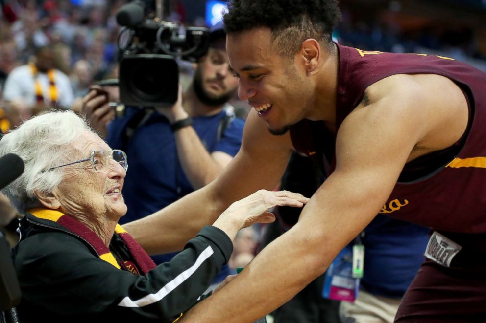 PHOTO: Marques Townes #5 of the Loyola Ramblers celebrates with Sister Jean Dolores-Schmidt after beating the Tennessee Volunteers in the 2018 NCAA Tournament at the American Airlines Center, March 17, 2018, in Dallas.