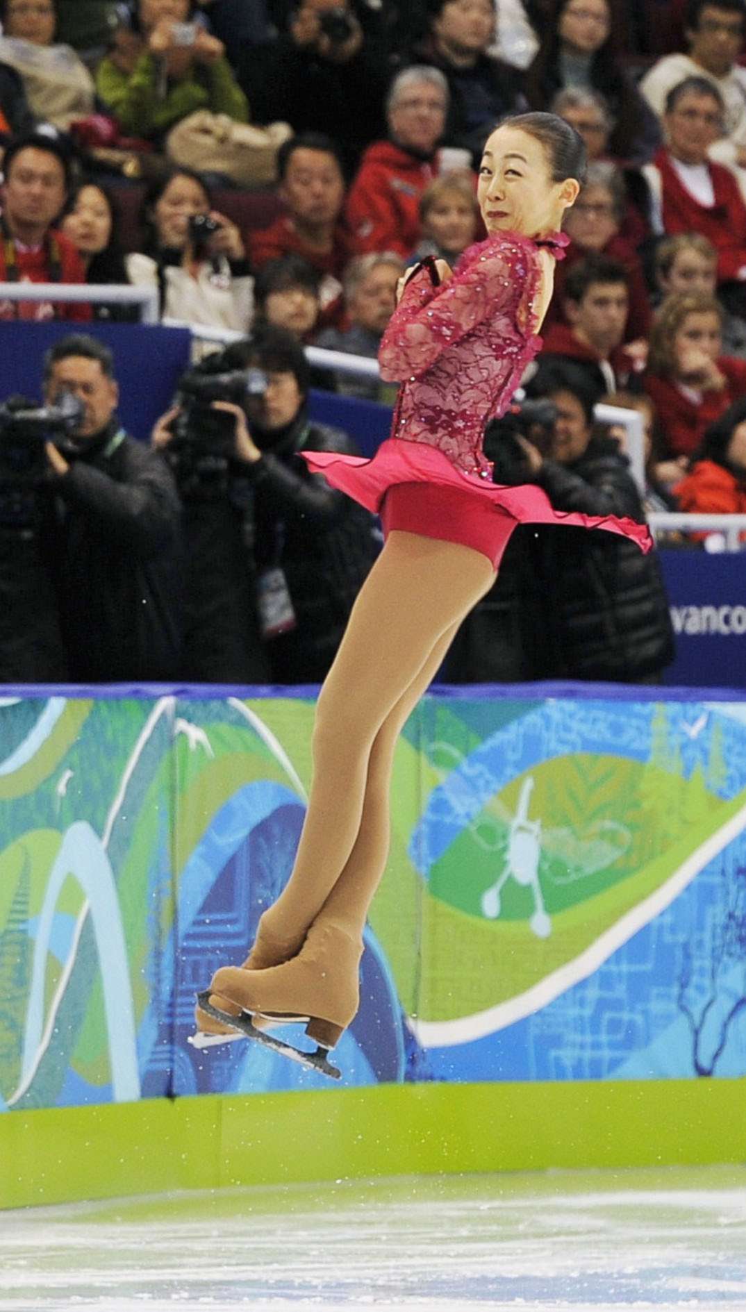 PHOTO: Japanese figure skater Mao Asada nails a triple axel in her short program at the Vancouver Olympics in Feb. 2010. 