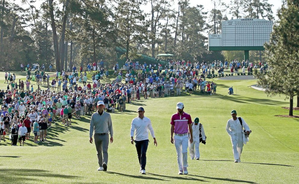 PHOTO: Amateur Matt Parziale, Rory McIlroy and Wesley Bryan walk up the second hole during a practice round prior to the start of the 2018 Masters Tournament at Augusta National Golf Club on April 2, 2018 in Augusta, Ga.