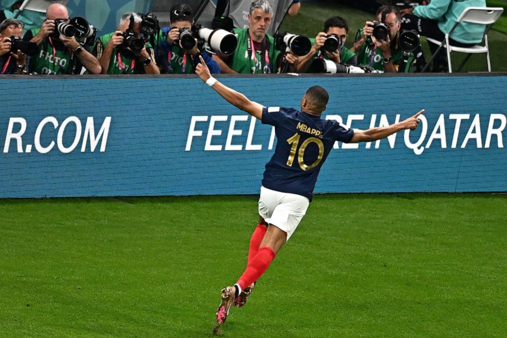 PHOTO: France's forward Kylian Mbappe celebrates scoring his team's third goal during the Qatar 2022 World Cup Group D football match between France and Australia at the Al-Janoub Stadium in Al-Wakrah, south of Doha on Nov. 22, 2022.