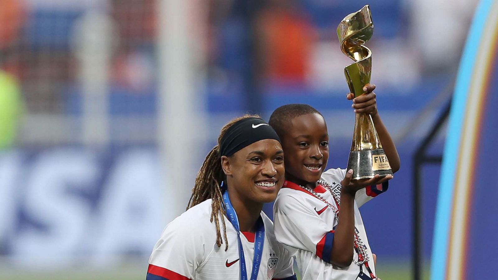 PHOTO: Jessica McDonald of the USA celebrates with her son following her team's victory in the 2019 FIFA Women's World Cup France Final match, July 7, 2019, in Lyon, France.