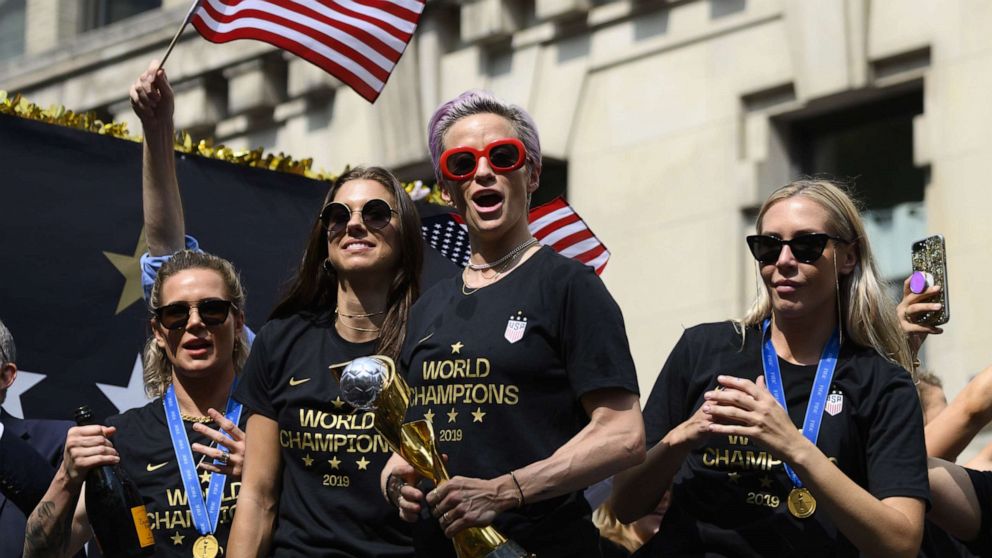 PHOTO: In this file photo taken on July 10, 2019, Megan Rapinoe, center, and other members of the World Cup-winning U.S. women's team take part in a ticker tape parade for the women's World Cup champions in New York.