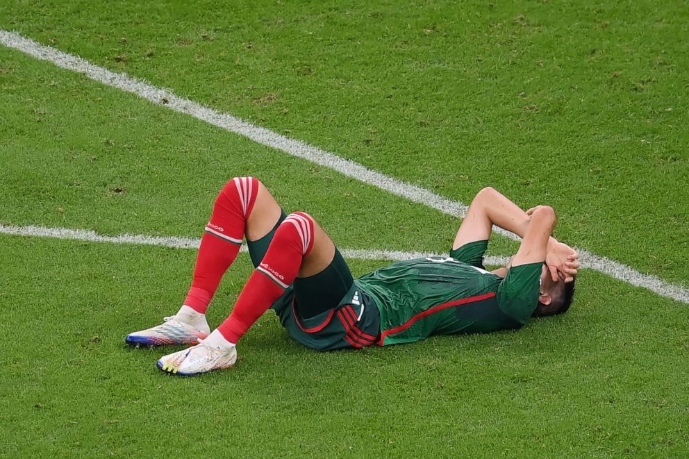PHOTO: Cesar Montes of Mexico shows dejection as the team fails to go through to the knockout stage despite his side's 2-1 victory in a World Cup Group C match between Saudi Arabia and Mexico at Lusail Stadium on Nov. 30, 2022, in Lusail City, Qatar.