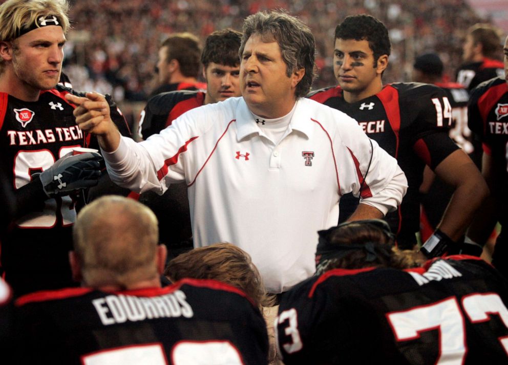 PHOTO: Texas Tech head coach Mike Leach talks with his team in the second quarter of an NCAA college football game against Texas A&M in Lubbock, Texas, Saturday, Oct. 24, 2009.