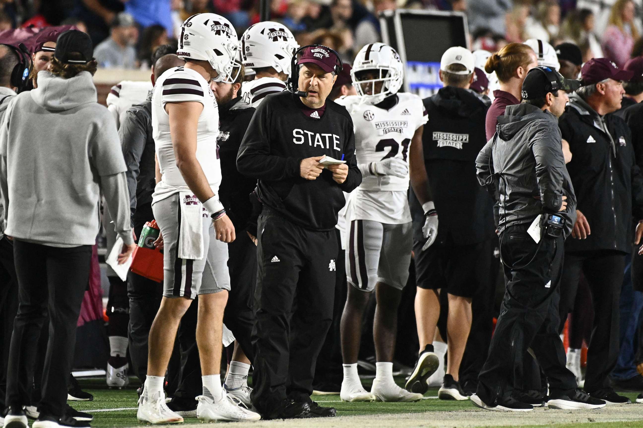 PHOTO: Mississippi State Bulldogs head coach Mike Leach speaks with quarterback Will Rogers during the first quarter of the game against the Ole Miss Rebels at Vaught-Hemingway Stadium, Nov. 24, 2022.