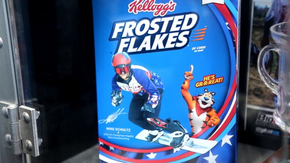 PHOTO: Mike Schultz, a professional Paralympics snowboarder, shows off his picture on a Kellogg's cereal box.