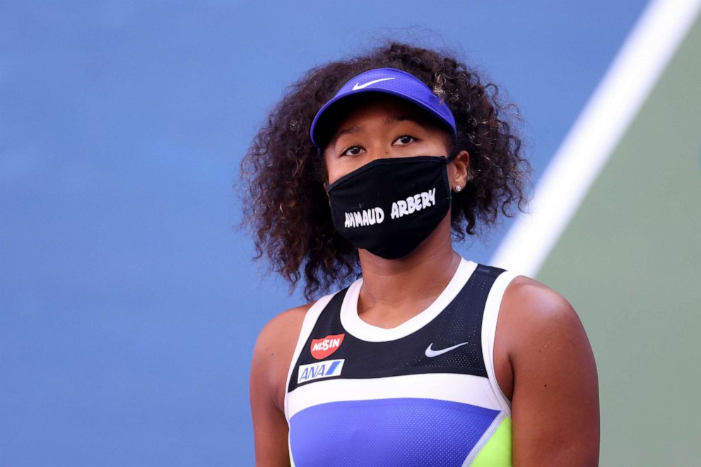 PHOTO: Naomi Osaka wears a protective face mask with the name, Ahmaud Arbery stenciled on it after winning her Women's Singles third round match on Day Five of the 2020 US Open in New York, Sept. 4, 2020.