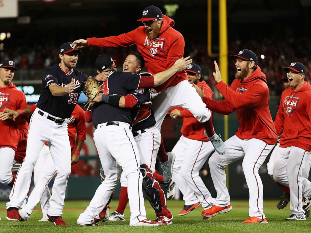 World Politics PHOTO: * The Washington Nationals celebrate winning game four of the National League Championship Series at Nationals Park on Oct. 15, 2019 in Washington, D.C.