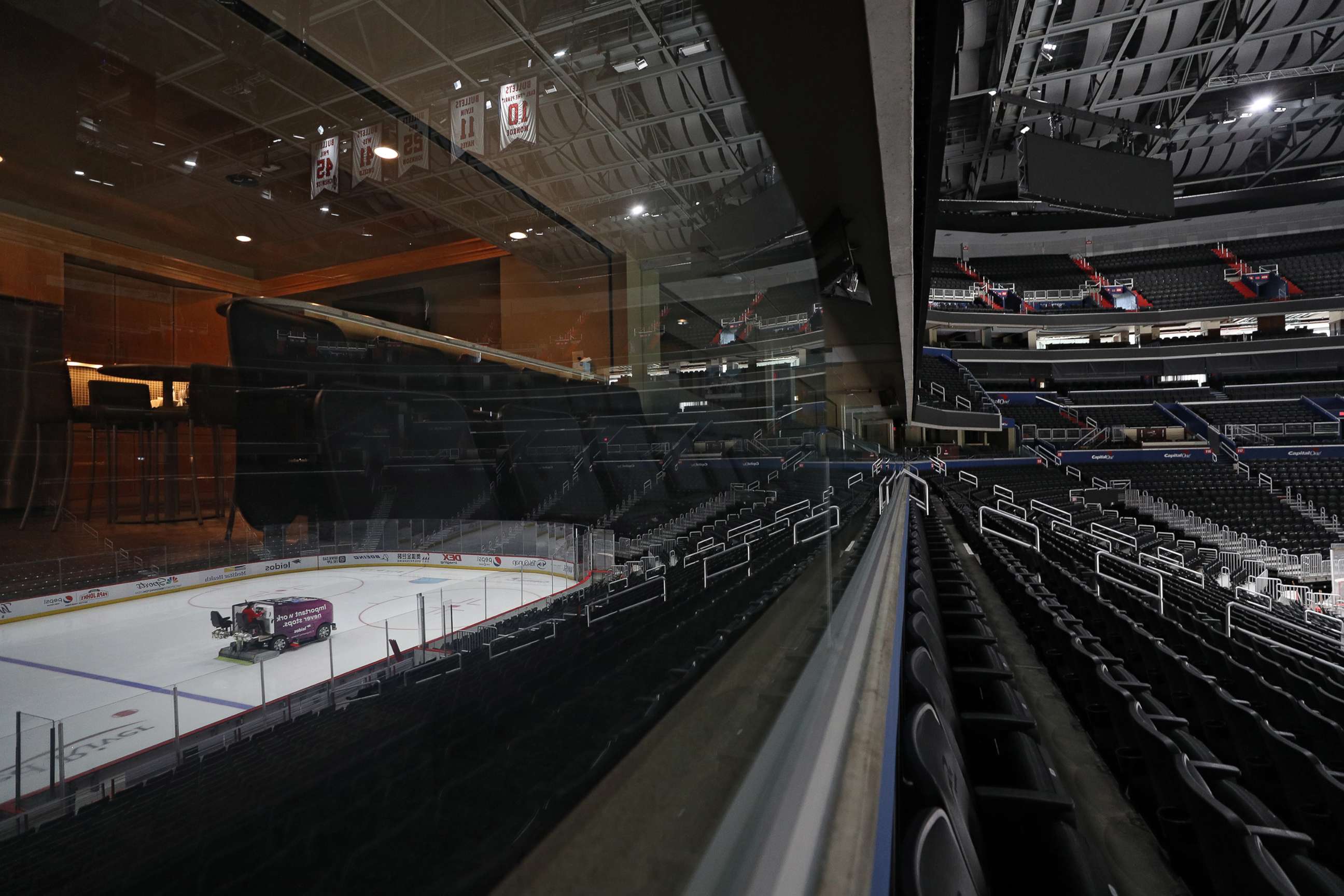PHOTO: The ice is cleaned and spectator seating is empty prior to the Detroit Red Wings playing against the Washington Capitals at Capital One Arena on March 12, 2020 in Washington.