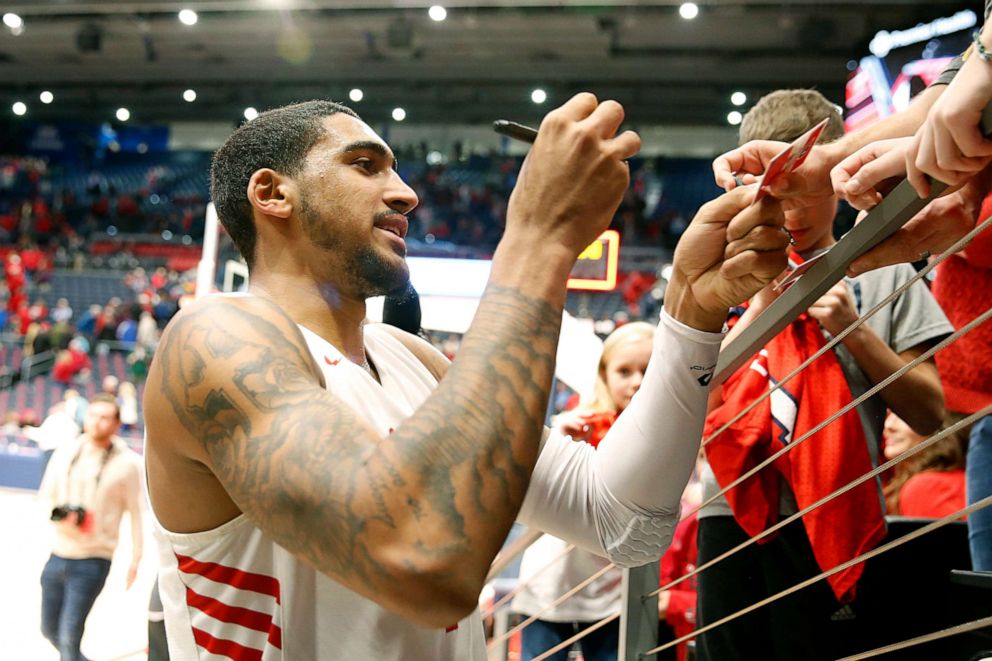 PHOTO: Obi Toppin #1 of the Dayton Flyers signs autographs after the game against the North Texas Mean Green at UD Arena, Dec. 17, 2019, in Dayton, Ohio. 