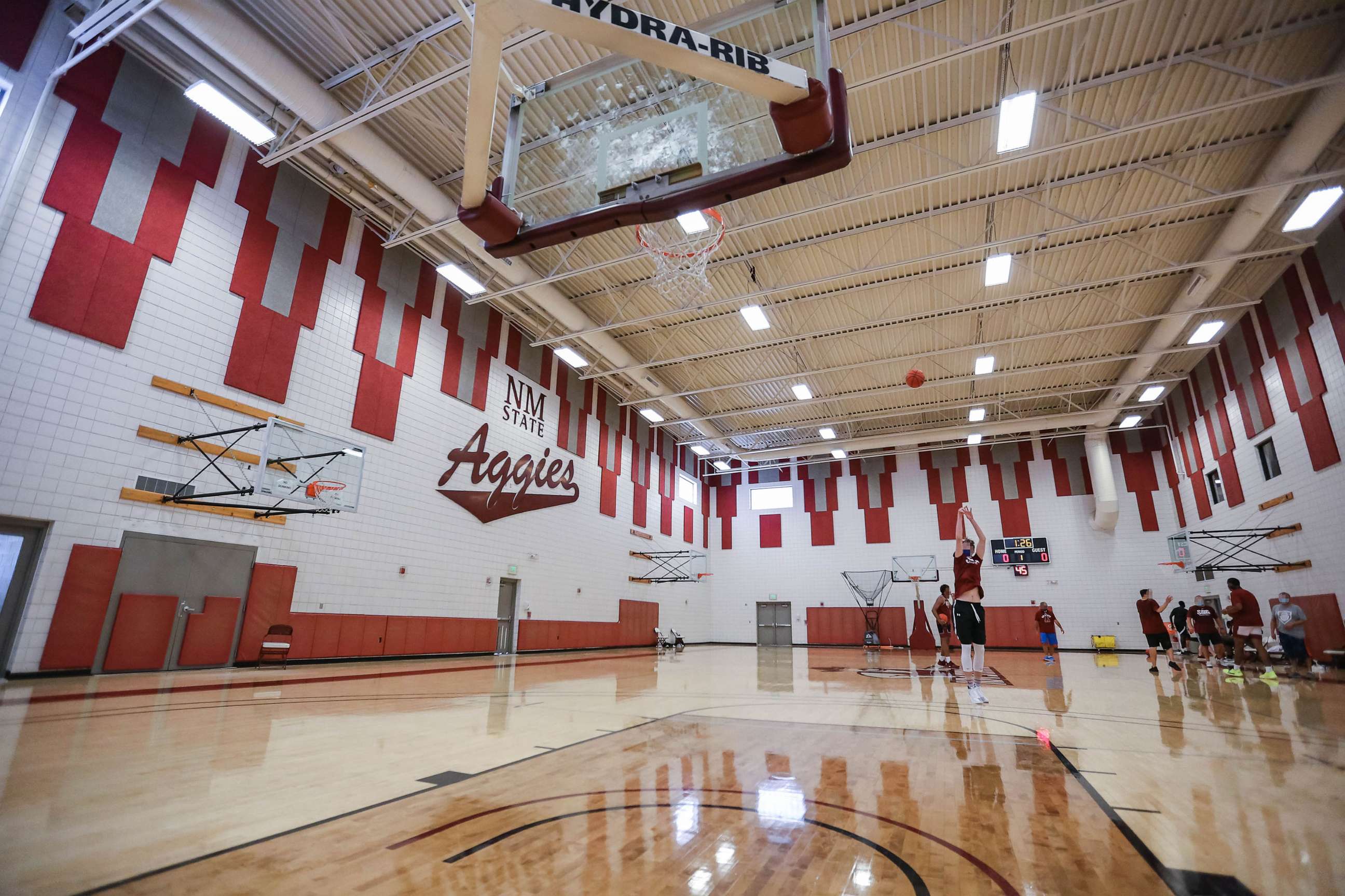 PHOTO: In this July 21, 2020, file photo, a New Mexico State player shoots a three at a pre-season practice for the NMSU men's basketball team in Las Cruces, N.M.