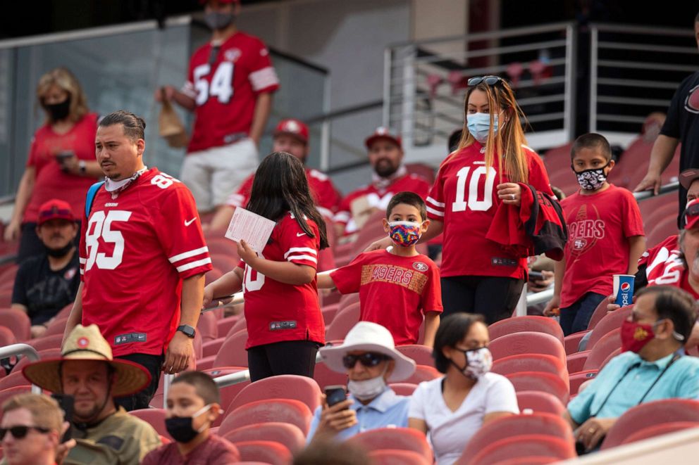 PHOTO: San Francisco 49ers fans arrive at Levi's Stadium for an NFL football open practice, Aug. 7, 2021, in Santa Clara, Calif.