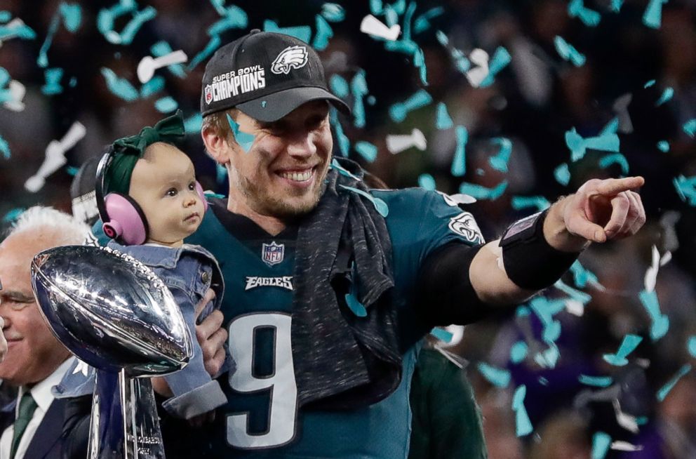 PHOTO: Philadelphia Eagles' Nick Foles holds his daughter, Lily, after beating the New England Patriots in the NFL Super Bowl 52 football game, Feb. 4, 2018, in Minneapolis.