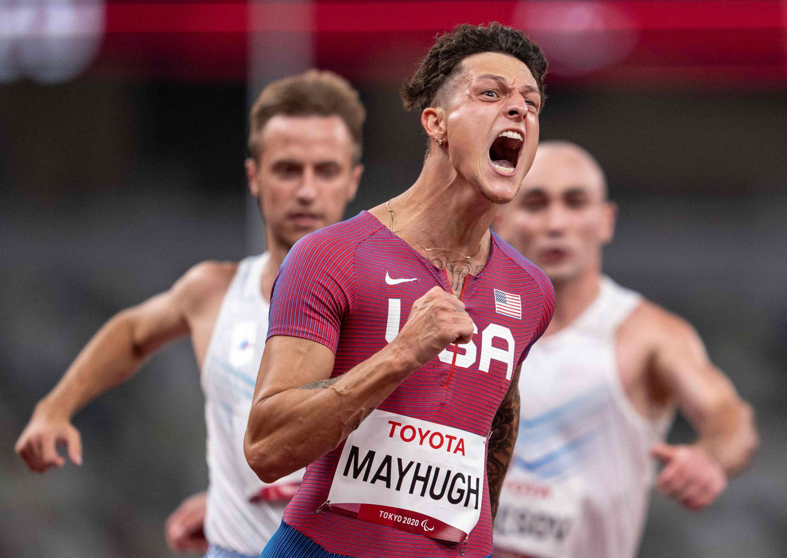 PHOTO: In this handout photo from the OIS of the IOC taken and released on Aug. 27, 2021, USA's Nick Mayhugh breaks the world record and wins the gold medal in the mens 100m T37 final during the Tokyo 2020 Paralympic Games at the Olympic Stadium in Tokyo.