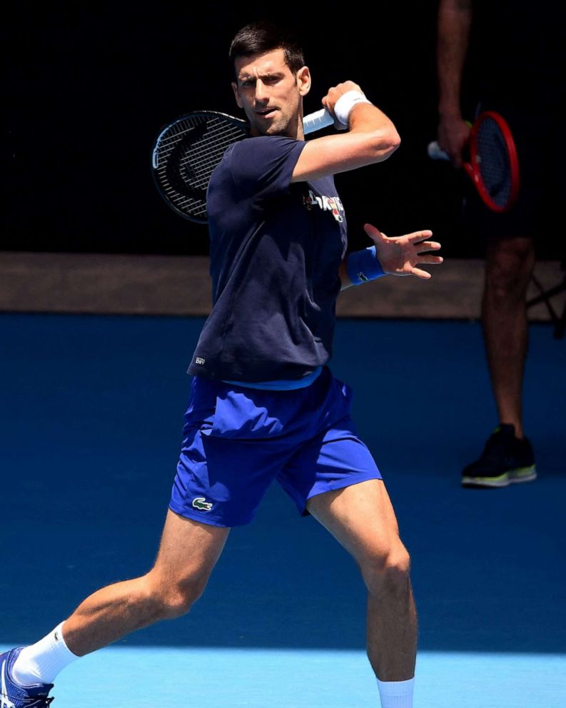 PHOTO: Novak Djokovic of Serbia hits a return during a practice session ahead of the Australian Open at the Melbourne Park tennis centre in Melbourne on Jan. 12, 2022. 