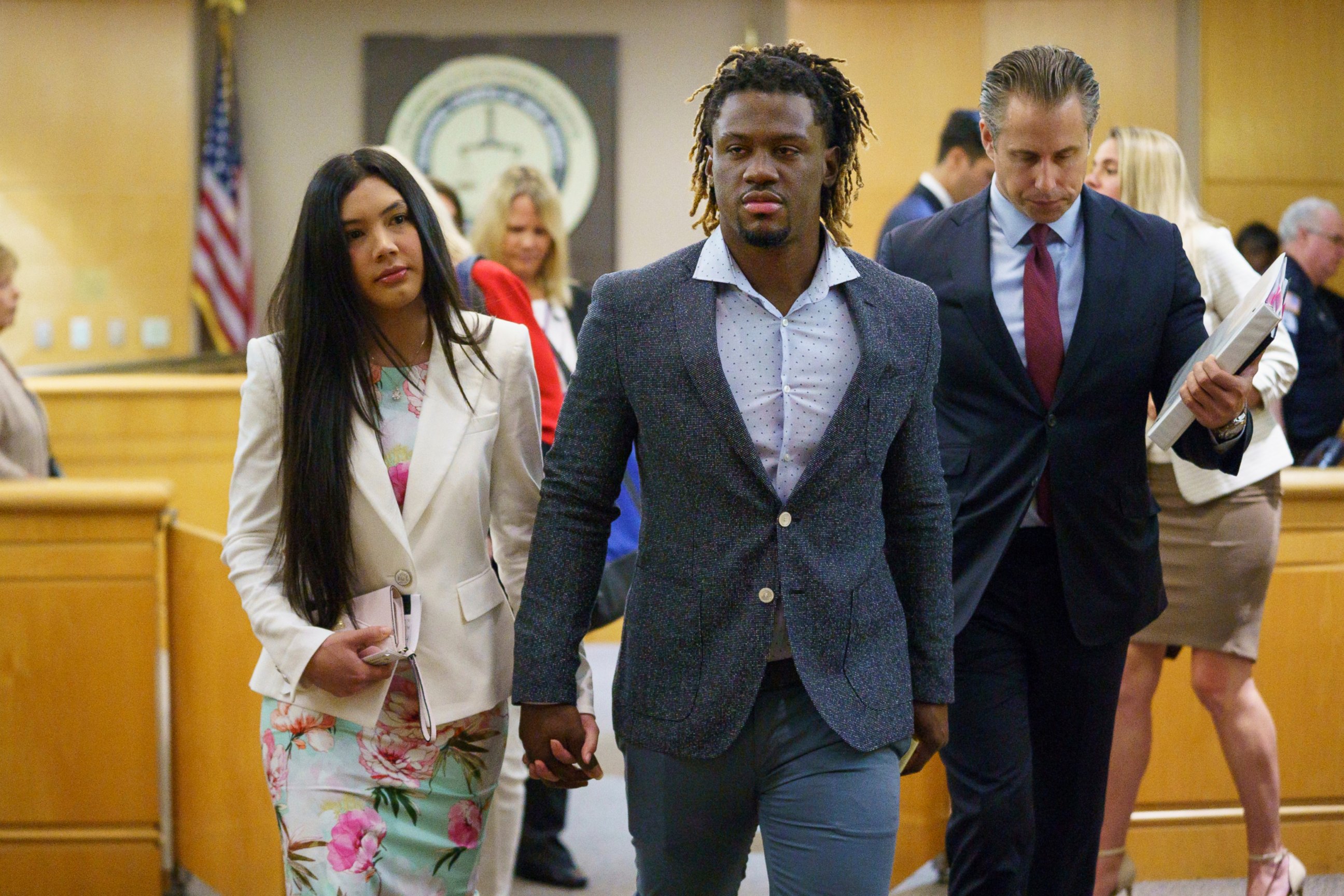 PHOTO: Philadelphia Phillies baseball player Odubel Herrera leaves a courtroom with an unidentified friend after a hearing on a domestic violence case in Atlantic City, N.J., Wednesday, July 3, 2019.