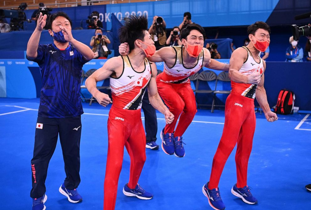 PHOTO: Japan's team celebrates winning a silver medal in the Men's Team Final at the Tokyo Olympic Games, July 26, 2021, at Ariake Gymnastics Centre in Tokyo.