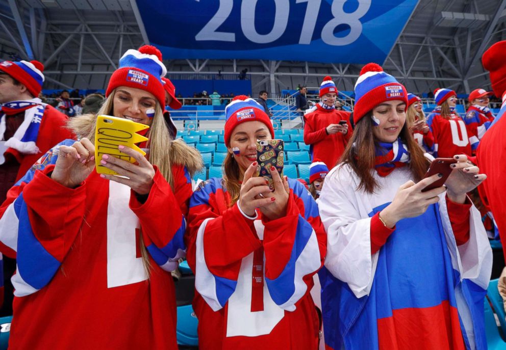 PHOTO: Russia fans check their phones before the Russia v Norway men's ice hockey quarterfinal game, Feb. 21, 2018, in Gangneung, South Korea.