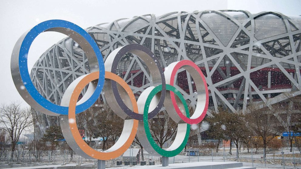 PHOTO: The Olympic rings and the National Stadium are shown amid snowfall in Beijing, on Jan. 20. 2022.